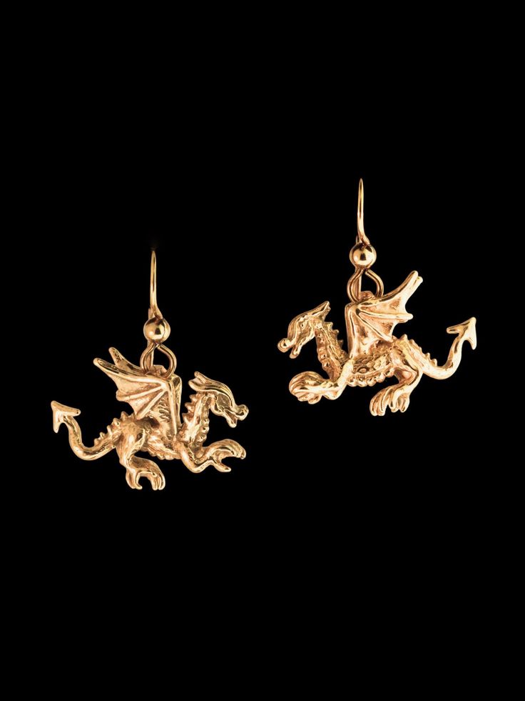 Don't be fooled by their diminutive size, our Tiny Welsh Dragon Earrings posses powerful spirits! These highly detailed and high stepping dragons are cast in 14K gold and are 7/8" long and 5/8" high not including the length of the ear wires. They are completely solid and three dimensional.  All Marty Magic Jewelry is packaged in a beautiful box, embossed with the gold foil Marty Magic dragon logo. Perfect for any occasion! Designed in Santa Cruz California by Marty Magic. . Symbolic 14k Gold Pierced Jewelry, Symbolic Yellow Gold Jewelry For Pierced Ears, Symbolic Yellow Gold Jewelry With Matching Earrings, Nickel Free Yellow Gold Jewelry For Collectors, Symbolic Yellow Gold Sterling Silver Earrings, Symbolic Drop Earrings With Ear Wire, Collectible Sterling Silver Drop Earrings, Collectible Yellow Gold Drop Earrings, Gold Symbolic Jewelry With Earrings Set