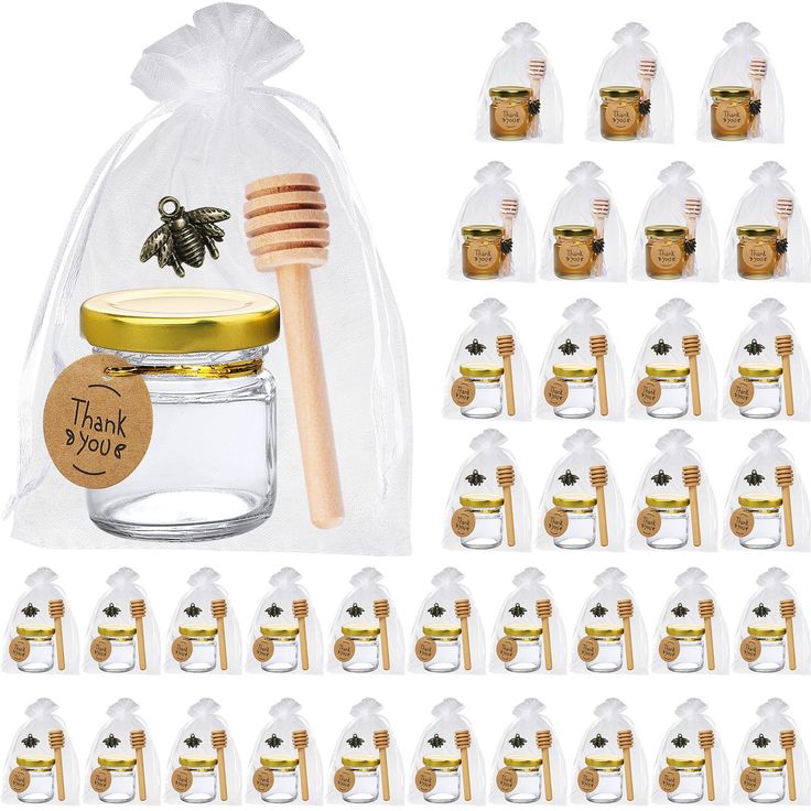 the honey jar and wooden spoons are in clear bags with gold foil tags on them