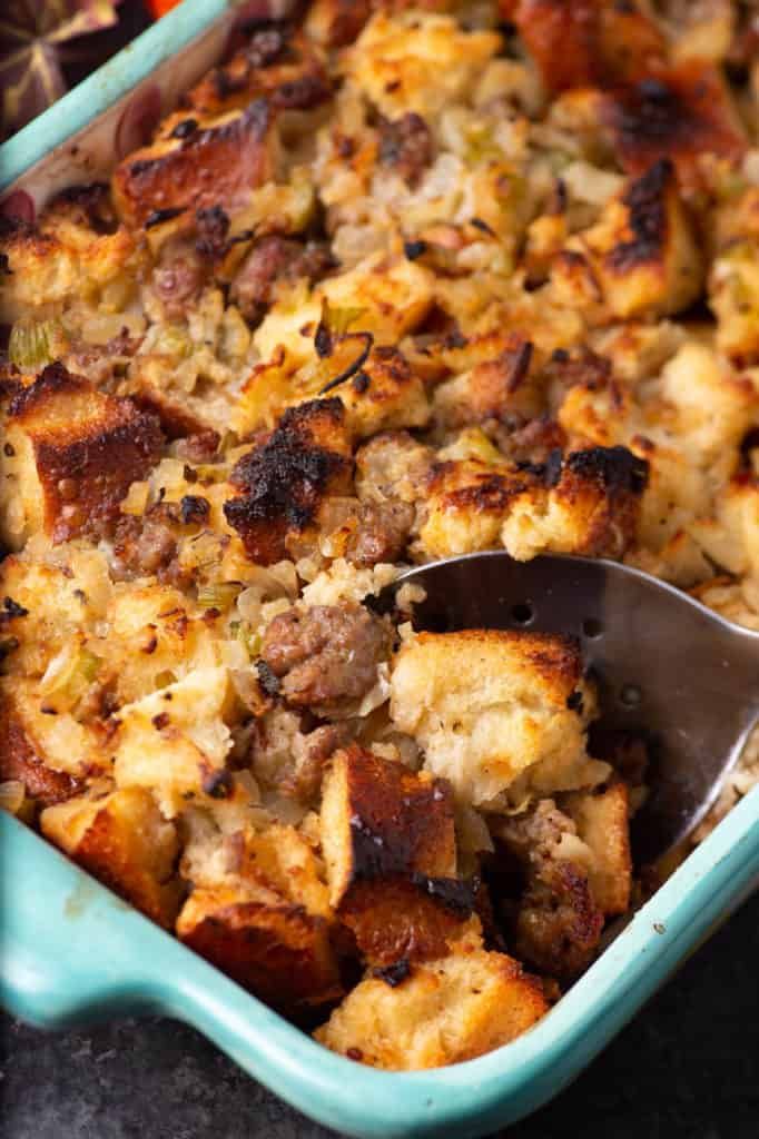 a casserole dish with sausage and stuffing