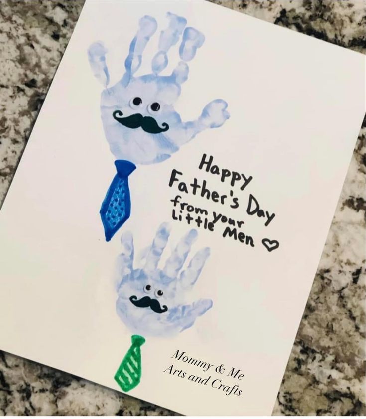 a father's day card with two handprints and a tie on it