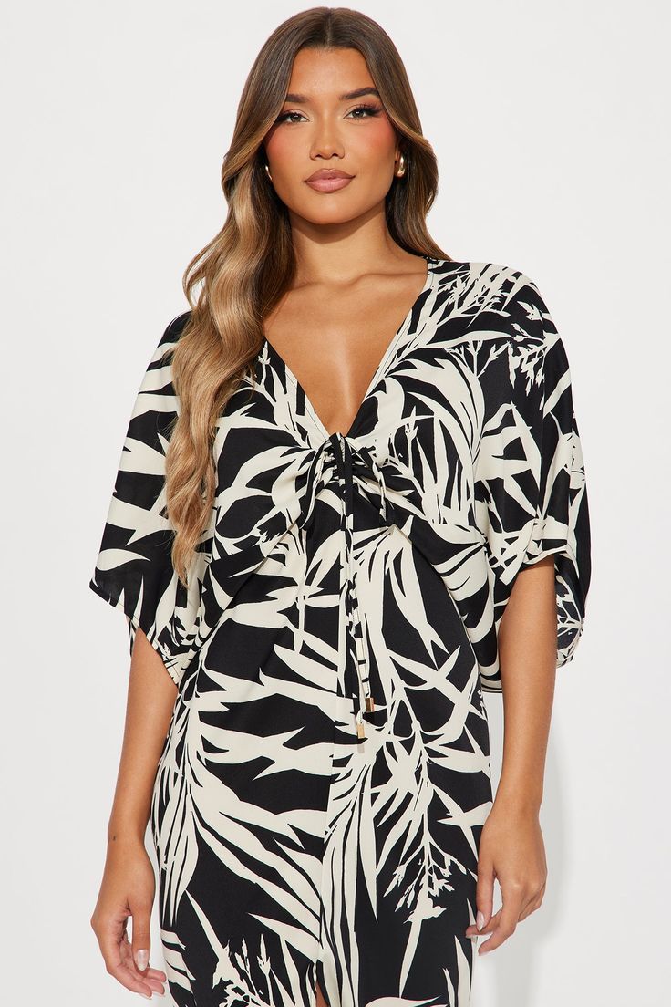 Available In Black/combo. Challis Midi Dress 3/4 Sleeves V-Neckline Drawstring Detail Ruched Length = 49" Disclaimer Pattern Placement May Vary Self: 100% Polyester Imported | Jamaican Breeze Midi Dress in Black size Medium by Fashion Nova Black V-neck Mini Dress For Vacation, Black Summer Tops With Tie Waist, V-neck Viscose Mini Dress For Beach, Printed V-neck Mini Dress For Date Night, V-neck Viscose Dress For Vacation, V-neck Rayon Dress With Tie Waist, Beachwear V-neck Rayon Dress, Beach V-neck Mini Dress With Tie Waist, Beach Mini Dress With Tie Waist And V-neck