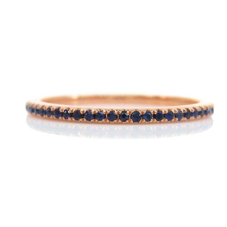 A gemstone eternity band is a perfect complement to any engagement ring or as stackable bands. DESCRIPTION: * Design: Full Eternity Band * Based on Ring Size: 6.5 * Metal: Solid 18K Yellow Gold * Gemstones: Genuine Sapphires * Color: Blue * Stone Count: 62 PCS * Weight: 0.22cts T.W * Band Width: 1.2mm (with +/- 0.1mm variation) Stone count & carat weight varies depending on the ring size. Beautiful Ring Box Included Classic Gemstone Eternity Band For Promise, Classic Gemstone Eternity Band As Promise Ring, Fine Jewelry Sapphire Ring With Stackable Round Cut, Luxury Gemstone Stackable Rings With Round Band, Fine Jewelry Stackable Round Cut Sapphire Ring, Elegant Stackable Sapphire Ring With Round Band, Elegant Stackable Sapphire Ring, Luxury Stackable Round Eternity Band, Sapphire Eternity Band With Vvs Clarity