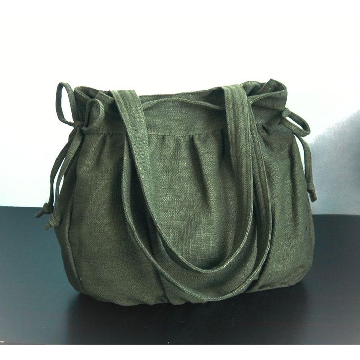 Please check 'shop announcement' for production time and delivery before your purchase.  This gorgeous bag is made from forest green pure hemp material. I really love its unique texture and the ruggedness of hemp, giving you a different feeling from other kinds of fabric. 12.5" top wide 12.5" tall 3.5" deep 23" straps This everyday bag is sturdy and roomy enough to hold your essentials, such as books, wallet, iPad, mobile and keys. It's fully lined with canvas, there are 2 slip pockets, one zipp Olive Satchel Shoulder Bag For Daily Use, Green Canvas Satchel With Top Carry Handle, Green Canvas Satchel Bag With Top Handle, Green Bag With Rolled Handles For Daily Use, Handmade Green Canvas Bag For Daily Use, Green Shoulder Bag With Rolled Handles For Travel, Daily Use Canvas Shoulder Bag With Rolled Handles, Handmade Green Hobo Bag For Everyday Use, Green Canvas Bag With Handles For Daily Use