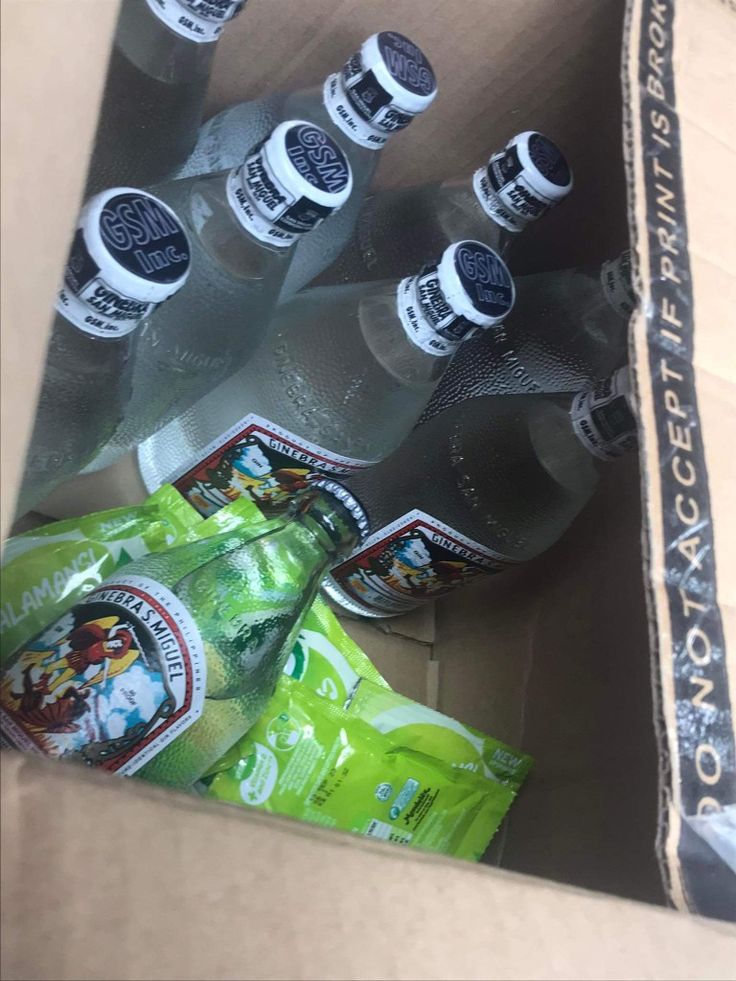 several bottles of water in a cardboard box