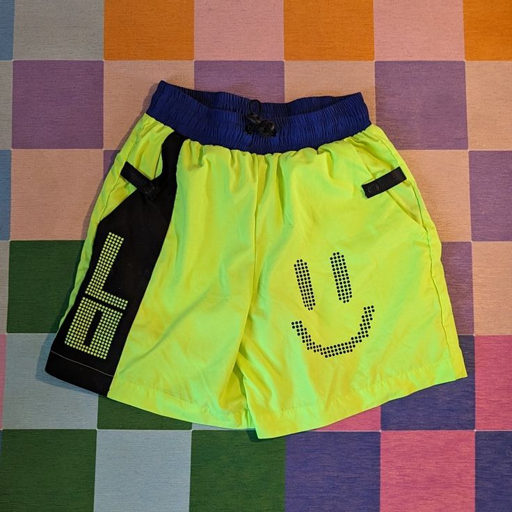 Never Worn! Perfect Condition Funky Shorts Or Swim Trunks! Brand: Lazy Oaf Size: Xs Color: Neon Yellow With Cobalt Blue Waistband And Black Accents Material: Microfiber Fabric, Elastic Bungee Cord Waistband With Pignose Toggles, Welt Pocket In The Back -- 100% Polyester Sporty Bottoms For Beach Season Playwear, Sporty Bottoms For Beach Playwear, Sporty Summer Bottoms With Elastic Waistband, Sporty Bottoms With Elastic Waistband For Summer, Summer Short Swim Trunks For Playwear, Summer Style Short Swim Trunks For Play, Sporty Beach Bottoms With Pockets, Sporty Bottoms With Pockets For Beach Season, Trendy Yellow Bottoms With Elastic Waistband