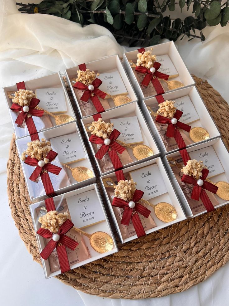 six boxes filled with different types of cookies on top of a wicker tablecloth