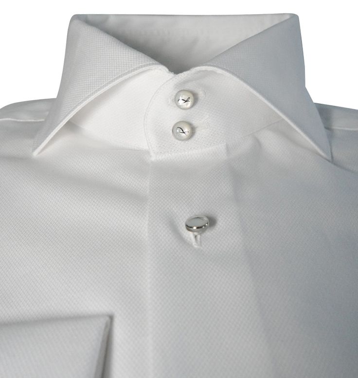 Our signature tuxedo dress shirt is something that has broken the internet. In a world where features like this are only found in custom shirts, we have decided to create a collection that delivers the same value without having to get measured and pay a hefty price. These shirts will give you that bold look! Never worry again about your collar sliding inside your jacket or not being even. No need for collar stays either! You will be addicted to your new shirts! Quality Details: White True to siz Elegant White Shirt With Hidden Button Closure, Modern Formal Shirt With Buttons, Formal White Tops With Covered Buttons, White Formal Tops With Covered Buttons, Luxury White Shirt With Concealed Placket, Tailored Timeless Formal Tops, Designer Fitted Shirt With Button Cuffs, Classic Formal Tops With Covered Buttons, Luxury Formal Tops With Fold Down Collar