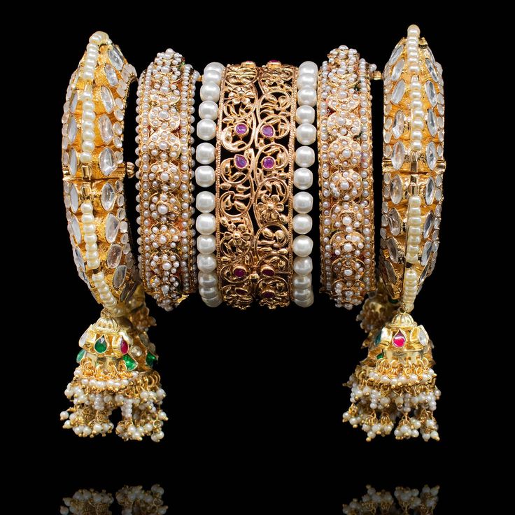 Adorn yourself in magnificence jewelry on your big day since you'll be looking nothing less than a queen! Exuding undeniable glamour, this bangle set features ornate filigree and enriched with beautiful stones for that ultimate sparkle. Gold-plated on high-quality brass as base metal. Made by order. Kindly allow 4-6 weeks for the delivery of this item. For custom or urgent requests, please contact support@alacouture.com. *Please Note: We use faux stones and beads in all of our jewelry. Beautiful Stones, Faux Stone, Bangle Set, Base Metal, Big Day, Gold Plate, Bangles, Plating, Sparkle