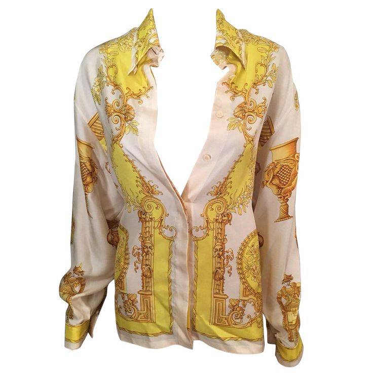 GIANNI VERSACE Vintage Sexy Plunging Decollete Silk Shirt Top IT 44 Versace vintage long sleeve blouse featuring print throughout, pointed collar and concealed button closures at front. About Versace: Founded in 1978 by the late Gianni Versace, this Italian design house specializes in sizzling glamour. Gianni's sister, Donatella Versace, has designed the label since 1997, creating luxuriously sexy dresses and separates. The line also includes shoes and a range of fragrances. Versace Blouse, Embellished Crop Top, Versace Vintage, Woman Casual, Versace Dress, Versace Couture, Printed Silk Shirt, Printed Silk Blouses, Vintage Versace