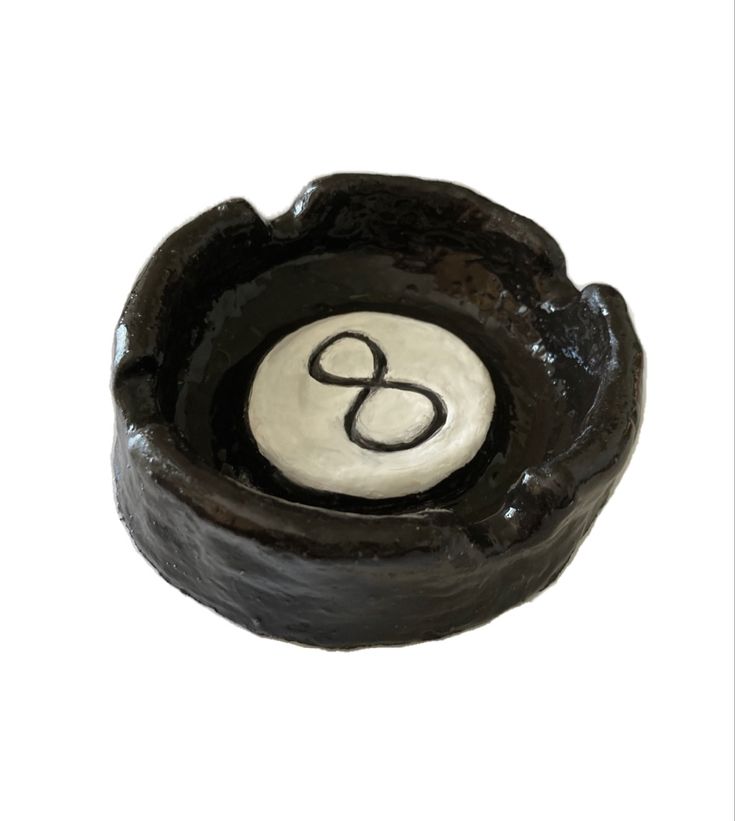 a black and white bowl with the letter o in it