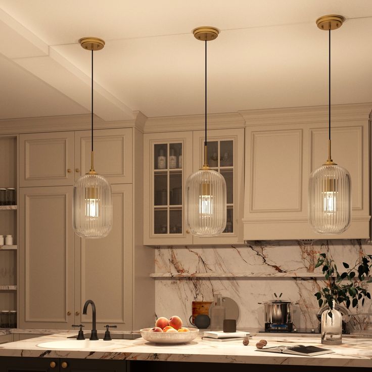 a kitchen with marble counter tops and hanging lights