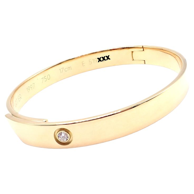 18k Yellow Gold Diamond Anniversary Bangle Bracelet By Cartier. Size 17. This bracelet comes with an original Cartier box. With 1 round brilliant cut diamond VS1 clarity, G color total weight .10ct This bracelet comes with service paper from Cartier store. Details: Size: 17 Width: 7mm Weight: 34.7 grams Stamped Hallmarks: Cartier 750 17cm 1997 E519XX(serial number has been omitted) *Free Shipping within the United States* Your Price: $8,500 T3472eodd Cartier Store, Cartier Diamond, Yellow Gold Bangle, Gold Anniversary, Diamond Anniversary, Gold Bangle Bracelet, Tennis Bracelet Diamond, Baguette Diamond, Round Brilliant Cut Diamond