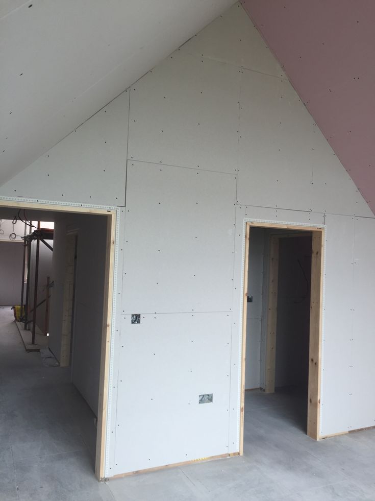 the inside of a house being built with unfinished walls and doorways on each side