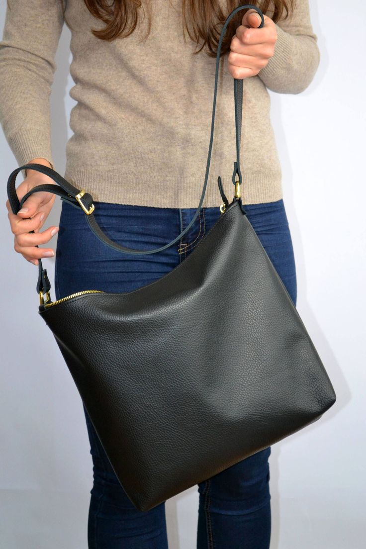 "Black leather hobo bag - BARCELONA Leather tote bag dimensions: Height: 12.5'' 32 cm Width: 14'' 36 cm Depth: 3'' 7 cm Strap: 35.5\"- 43.3\" 90 - 110 cm Simple and roomy hobo bag made from high quality pebbled leather. This hobo bag is suitable for carrying everything in your everyday life. Spacious interior provides room for all the daily essentials and more. It has a top zip closure. Perfect for everyday and evening! BARCELONA leather hobo * Highest quality Italian leather * Includes interior Soft Leather Bag, Hobo Crossbody Bag, Hobo Bags, Burberry Handbags, Leather Bag Women, Black Leather Bags, Leather Hobo Bag, Black Crossbody, Women Leather