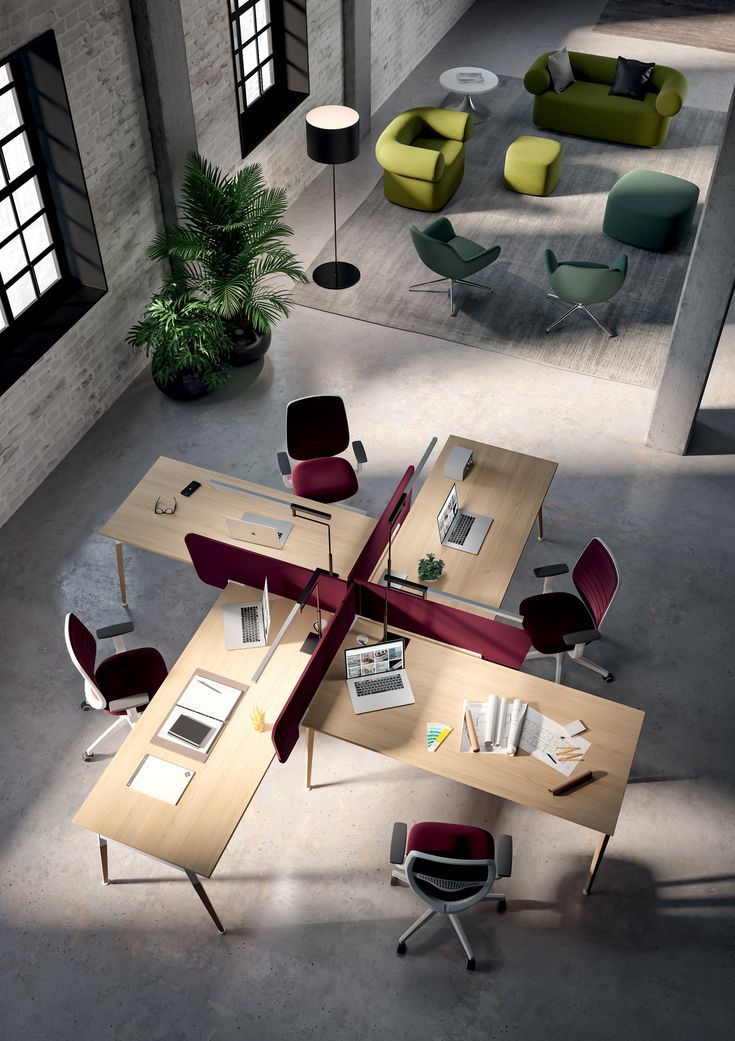 an aerial view of a modern office with multiple desks, chairs and couches