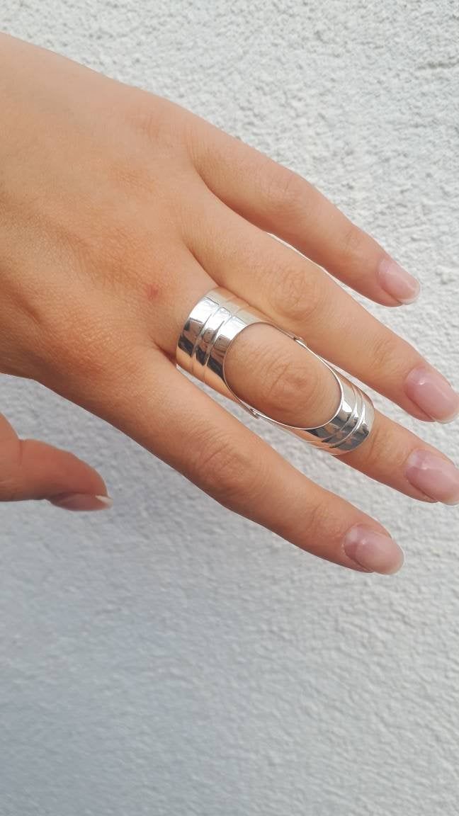 Armor rings Shield ring Double ring Joint ring Knuckle ring Statement ring Full finger ring Armenian silver Ring Large Ring Unique Ring NOTE. Please choose your exact size , as the band is wide we make it a bit larger More armor rings check out here https://www.etsy.com/listing/823916704/armor-full-finger-ring-shield-ring?ga_search_query=full%2Bfinger&ref=shop_items_search_1&pro=1&frs=1 https://www.etsy.com/listing/779039553/full-finger-ring-double-ring-shield-ring?ref=shop_home_acti Unique Open Band Midi Rings For Promise, Unique Metal Open Band Rings, Unique Metal Rings With Open Band, Unique Open Band Metal Rings, Silver Crystal Open Band Promise Ring, Modern Metal Toe Ring, Minimalist Silver Open Ring Crystal Ring, Minimalist Metal Toe Ring, Minimalist Silver Open Crystal Ring