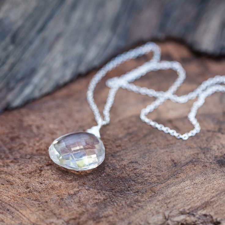 Signature Necklace! Quartz Crystal aka "Protected Being"high vibration crystal wire wrapped necklace in sterling silver. Empowerment through Protection Jewelry: Enhance Your Aura and Confidence Quartz is a Power Protector, healing energy stone. A clear, sparkly, faceted quartz crystal briolette pendant necklace. This clear white crystal is considered a “master healer.” It's said to amplify energy by absorbing, storing, releasing, and regulating it. It's also said to aid concentration and memory. Clear Gemstone Necklaces For Healing, Faceted Briolette Crystal Necklace In Sterling Silver, Spiritual Crystal Necklace In Clear Color, Spiritual Silver Necklace With Natural Inclusions, Clear Crystal Spiritual Necklace, Clear Sterling Silver Pendant Necklace, Sterling Silver Clear Necklaces For Jewelry Making, Sterling Silver Necklaces For Jewelry Making, Sterling Silver Necklace With Clear Round Pendant