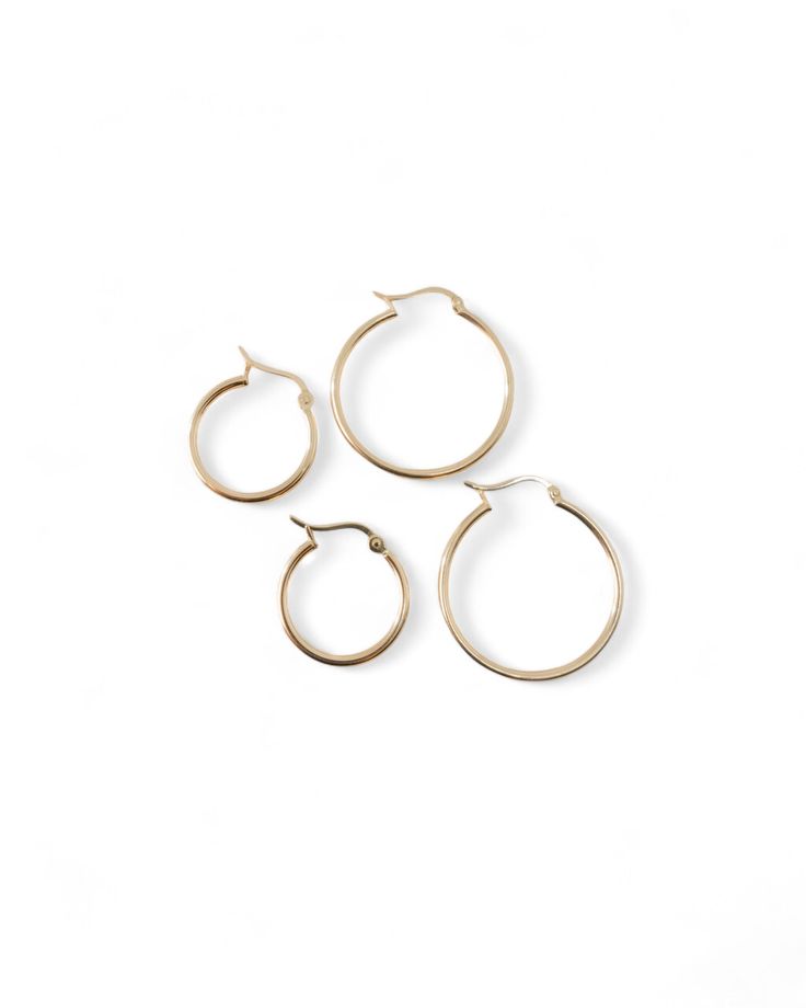 details: minimal hoops in solid 18k yellow gold finish choice of 15mm or 20mm diameter in size band width approx. 1.5mm latch back closure Style with Northern star pendent, solo freshwater pearl pendent or mini lock and key pendent Minimalist Everyday Hoop Jewelry, Minimalist Small Hoop Jewelry In Yellow Gold, Minimalist Small Hoop Jewelry With Polished Finish, Everyday Small Hoop 14k Gold Jewelry, Simple Small Hoop Everyday Jewelry, Minimalist Small Hoop Yellow Gold Jewelry, Everyday 14k Gold Small Hoop Jewelry, Hypoallergenic Small Hoop Jewelry For Everyday Luxury, Classic 14k Gold Open Circle Jewelry