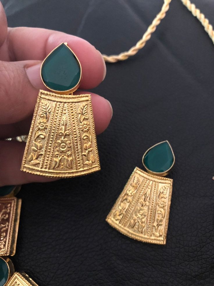 Gold plated and handcrafted with semi precious emerald stones necklace set Perfect for wedding and parties Pre order. Pendant Jewelry Sets With Stone Setting, Traditional Emerald Pendant Necklace For Formal Occasions, Gold Plated Kundan Necklace With Stone Work For Gift, Party Kundan Jewelry Sets With Stone Setting, Kundan Jewelry Set With Green Gemstones, Green Kundan Gemstone Jewelry Set, Gold Kundan Necklace With Hand-set Emeralds, Emerald Kundan Necklace For Gifting, Gold Kundan Necklace With Hand Set Emeralds