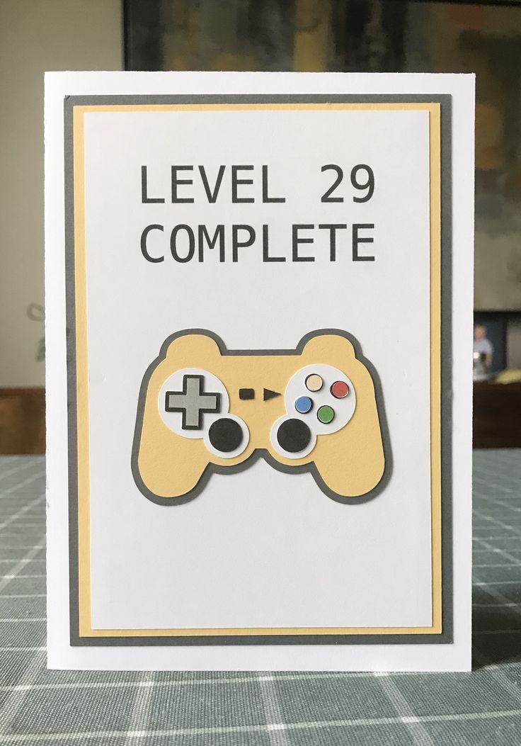 a close up of a card with a video game controller in the middle and text that reads level 29 complete