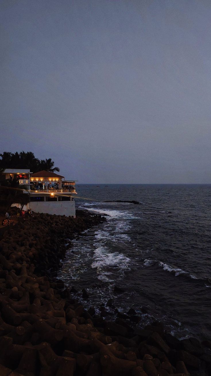 the ocean and shore line at night time