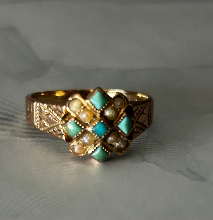 This is a antique Victorian ring in 10k rose gold. This ring has seed pearls and turquoise stones. Ring has initials VRF etched inside ring. Ring is in good condition with only age related wear. Ring is a size 7.5. Ring isn't marked 10k but was tested. Vintage Yellow Gold Turquoise Ring Hallmarked, Antique Yellow Gold Turquoise Ring For Anniversary, Vintage Yellow Gold Turquoise Ring For Anniversary, Vintage Yellow Gold Turquoise Ring For Wedding, Vintage Yellow Gold Turquoise Wedding Ring, Vintage 14k Gold Turquoise Ring, Vintage 14k Gold Turquoise Ring For Anniversary, Antique Yellow Gold Turquoise Ring Gift, Vintage Gold Turquoise Ring