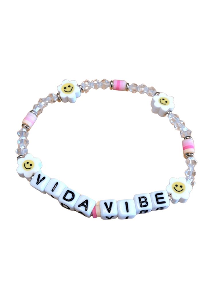 Beaded Smiley VidaVibe Bracelet! The childhood friendship bracelets gets an extra chi look! The stackable style features a strand of fun beads, with silver accents and bold lettering that spells out “VIDAVIBE.” What's your VidaVibe? Get ready to be inspired! Live. Love. Play. It’s a great gift idea for friend, sister, BFF, teammates. It’s a perfect gift for birthday, Valentine's day, Christmas, graduation, or any other gift giving occasions for women. 3 Bracelets for $15, No Code Needed! Trendy Beaded Bracelets With Letter Print, Trendy Beaded Bracelets With Letter Beads, Trendy Pink Beaded Bracelets With Letter Print, Trendy White Charm Bracelet With Letter Beads, Trendy Stretch Bracelet With Letter Print Beads, Trendy Stretch Bracelet With Letter Print And Round Beads, Trendy Stretch Bracelet With Letter Print, Trendy Beaded Name Bracelet, Casual Pink Bracelet With Letter Print