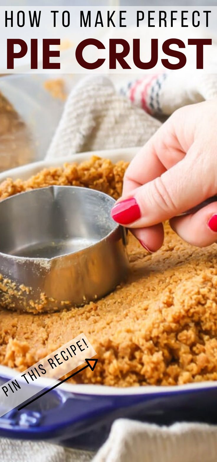 a person scooping some food out of a pie crust in a blue baking dish