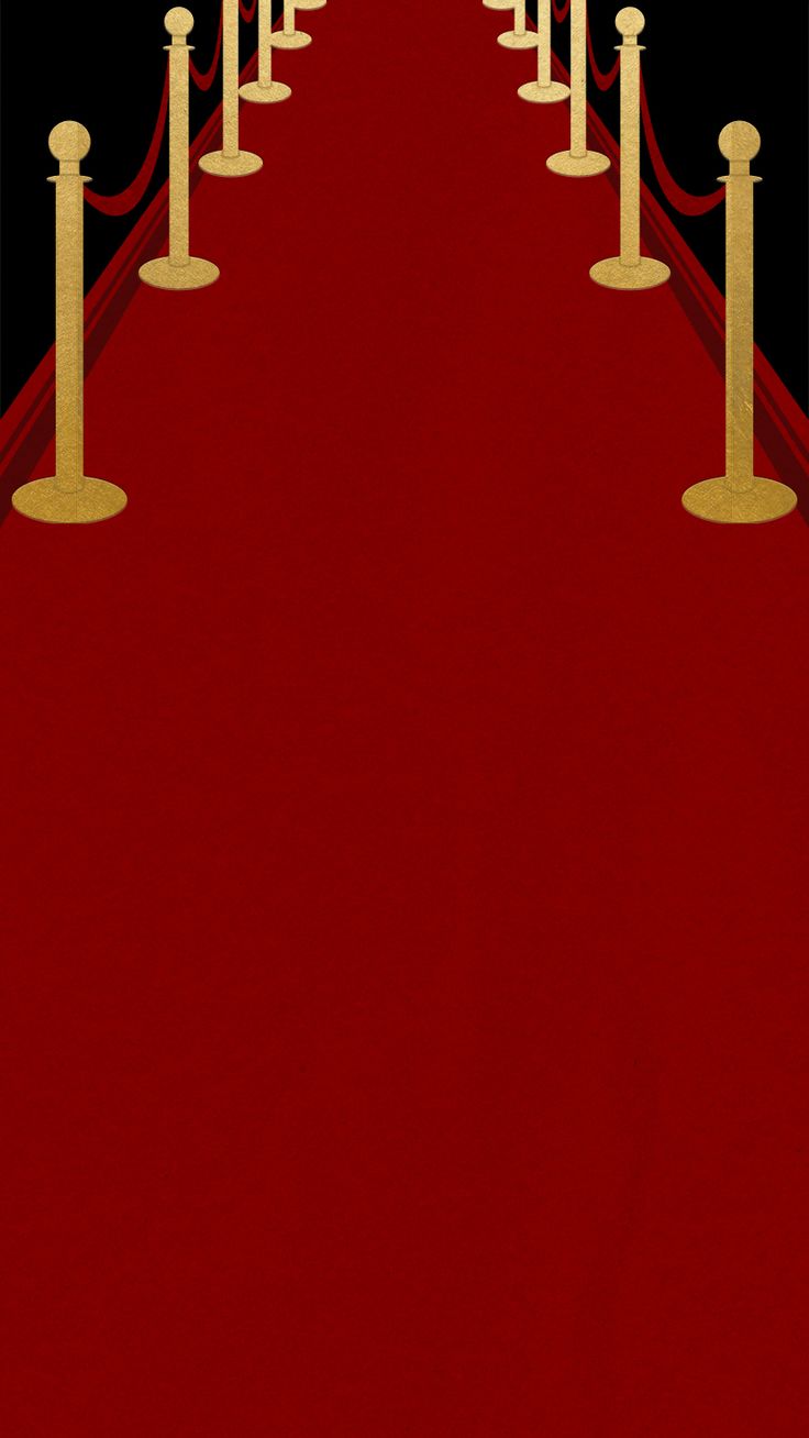 the red carpet is lined with gold poles