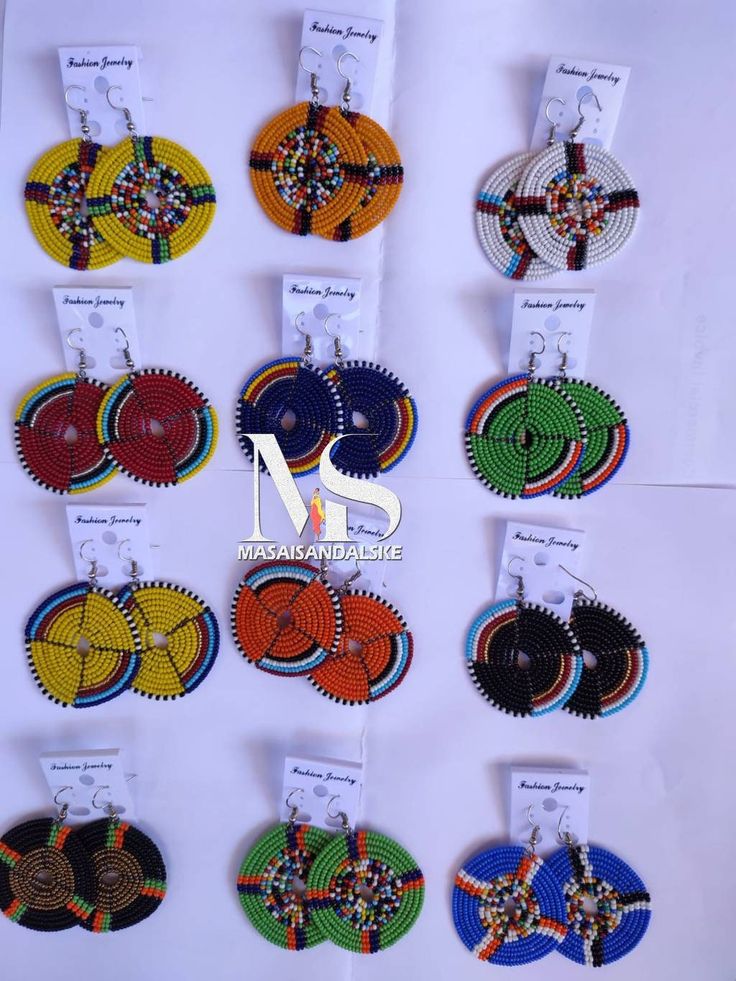 Set wholesale earrings Go ethnic with our African Maasai tribal earrings skillfully made with passion and ancient jewelry making tradition of the Maasai people of Africa Artisan Multicolor Round Beaded Earrings, Handmade Traditional Multicolor Hoop Earrings, Handmade Multicolor Traditional Hoop Earrings, Traditional Handmade Multicolor Hoop Earrings, Traditional Handmade Green Hoop Earrings, Traditional Round Bead Earrings For Festivals, Traditional Round Beaded Earrings For Festival, Traditional Beaded Hoop Earrings, Traditional Dangling Beads For Crafting