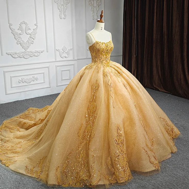 Details:     Silhouette: Ball-Gown Style    Fabric: Tulle Fabric    Color: Gold Color   Length: Chapel-Train    Neckline: Spaghetti Straps Neckline    Sleeves: Sleeveless    Back: Lace-Up Back    Embellishment: Appliqued Disney Quinceanera, Wedding Dress Yellow, Yellow Ballgown, Ball Gown Gold, Cotillion Dresses, Yellow Wedding Dress, Quinceanera Themes Dresses, Quinceanera Dresses Gold, Gold Tulle