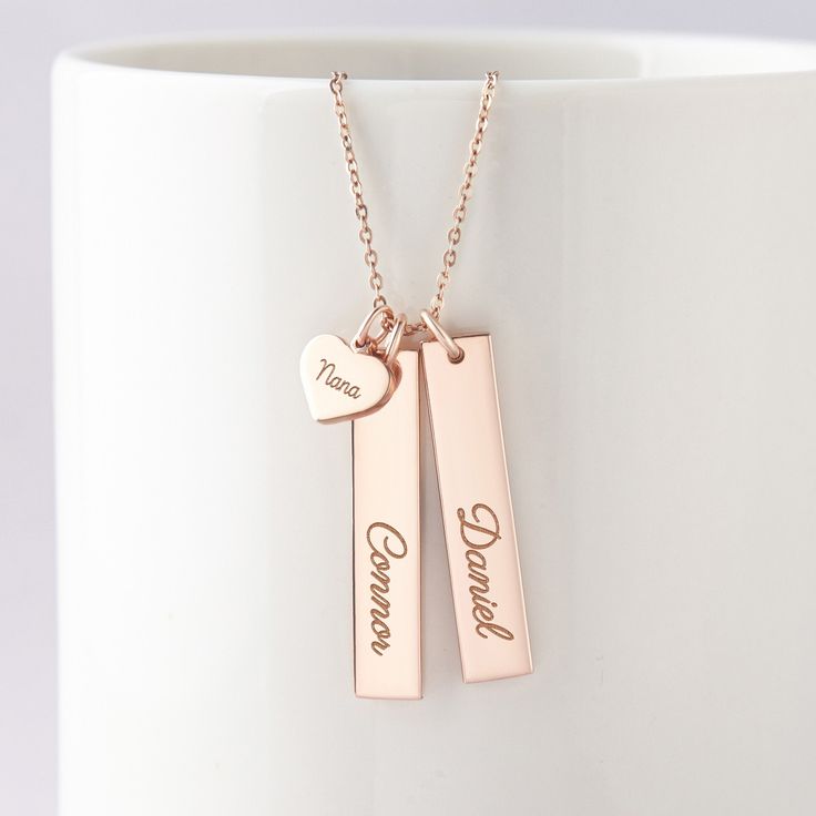 "This beautiful grandma necklace is engraved with your children's names on each charm. It's a perfect gift for your loved one with up to 5 personalized charms. PRODUCT INFO * Material: Solid 925 Sterling Silver * Dimensions: Bar charm measures ~ 1 1/4\" x 1/4\" (32 x 6.5mm). Heart charm measures ~3/8\"x5/16\" (9.5 x 8.2mm) * Word limits: 1 name/charm * By default, silver charm comes with BLACK engraving and gold-plated charm comes with CLEAR engraving HOW TO ORDER * Select your preferred finishi Personalized Rose Gold Name Necklace, Customizable Rose Gold Necklaces For Birthday Gift, Customizable Rose Gold Necklaces, Mother's Day Sterling Silver Name Charm Necklace, Mother's Day Sterling Silver Name Charm Necklaces, Mother's Day Sterling Silver Charm Necklace With Names, Sterling Silver Name Charm Necklace For Mother's Day, Sterling Silver Charm Necklaces With Names For Mother's Day, Custom Name Rose Gold Necklace For Gift