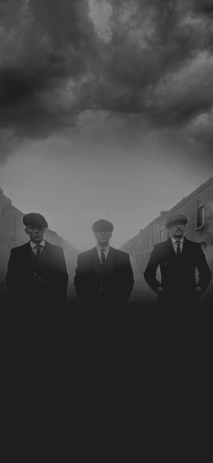 three men in suits and ties standing next to each other under a cloudy sky with buildings behind them