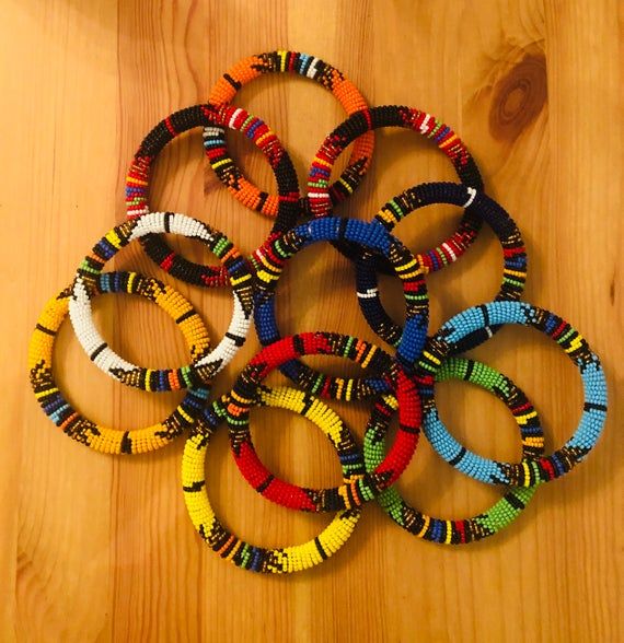 African Zulu beaded bracelets | Etsy African Folklore, African Beaded Bracelets, African Crafts, Bracelets Etsy, African Beads, Zulu, Sun Hats, Washer Necklace, Halloween Wreath