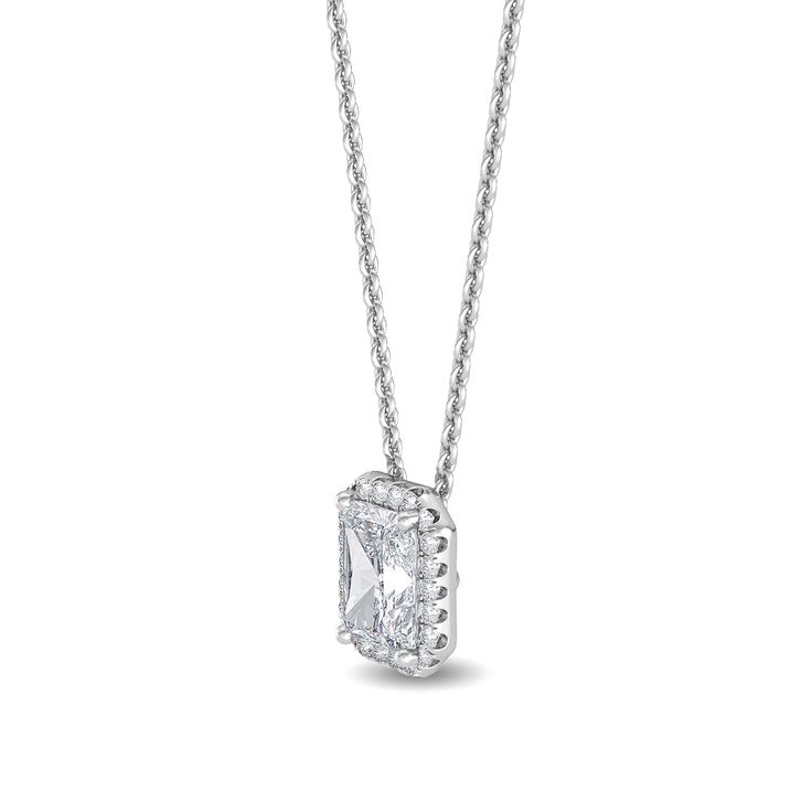 This Halo Pendant Lab Grown Diamond Necklace is sure to take your breath away. Featuring a radiant cut diamond, this lab grown necklace offers .93 ctw of sparkling brilliance. Get ready to dazzle with this timeless piece of jewelry. Center Stone: radiant cut lab grown diamond, .75 ct, F/G Color, VS1 Halo: round lab grown diamonds, .18 ct. 18", lobster clasp .93 carat total weight *This item is custom made just for you in your metal preference. *Please contact us prior to purchasing with any ques White Diamond Necklace With Princess Cut, Formal Princess Cut White Gold Necklace, Timeless Diamond Necklace With Square Pendant, Classic Formal Necklace With Rectangular Pendant, Formal Diamond White Square Pendant Necklace, Classic Formal Necklaces With Rectangular Pendant, Luxury Diamond Necklace With Emerald Cut And Prong Setting, Diamond Princess Cut Solitaire Necklace In Fine Jewelry Style, Luxury Diamond Necklace With Emerald Cut In Prong Setting