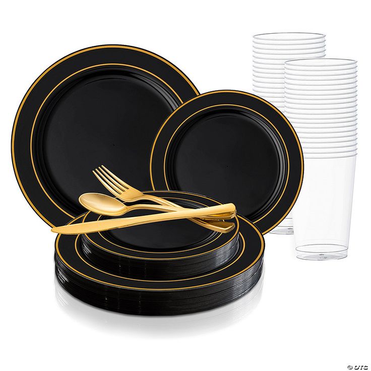 black and gold dinnerware set on white background