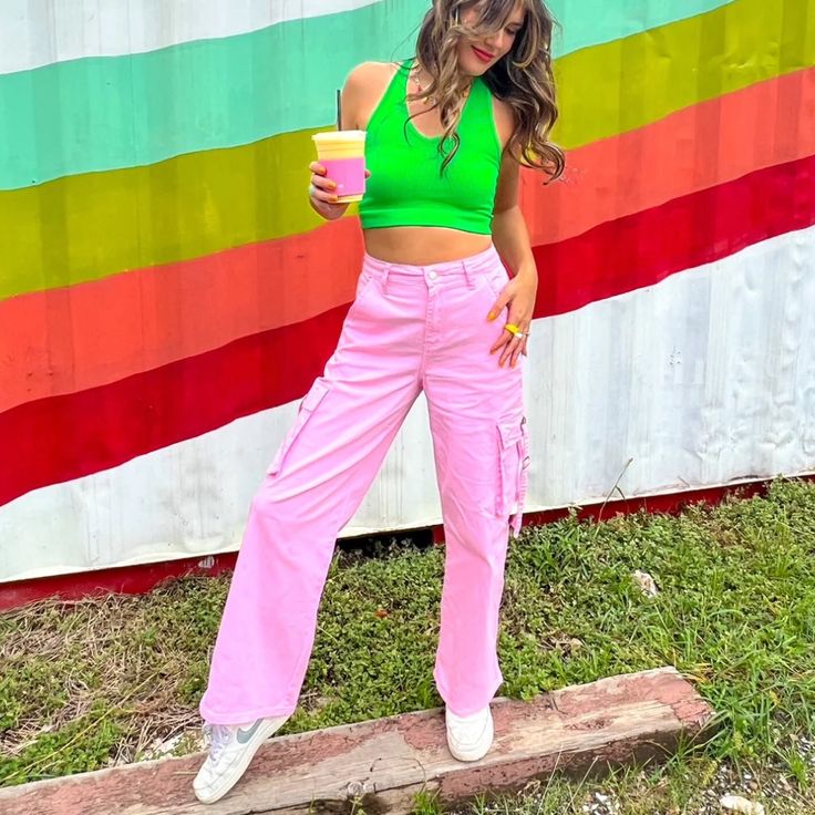 The Pants That Go With Everything. Our Baby Pink Cargos Are The Perfect Mix Of Cool-Girl And Girlie Style. You Will Love These For Their Flattering High-Waisted Fit, Cool Pockets, And Soft Pink Color. We Paired Ours With The Ombre Rainbow Mesh Top. The Coolest Cargos Around Soft Baby Pink Color They Have Pockets Flattering High-Waisted Fit Some Stretch Cool Girl Energy Incoming... True To Size 97% Cotton 3%Spandex Kalianna Is 5'7 Wearing A Size Small And Typically Wears A Size Small. Haley Is 5' Spring Pink Stretch Cargo Pants, Pink High-waisted Cargo Pants For Summer, Pink Stretch Cargo Pants For Spring, Trendy High Waist Pink Cargo Pants, Pink High Waist Parachute Pants For Spring, Spring Pink Bottoms With Cargo Pockets, Trendy Pink Cotton Parachute Pants, Pink Fitted Cargo Pants, Y2k Green Cargo Pants For Spring