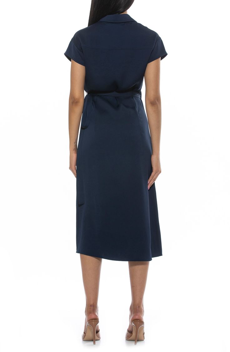 Show off sophisticated style in a surplice wrap midi dress fashioned with a neatly spread collar and O-ring tie closure. Spread collar Cap sleeves True wrap style with side tie closure 100% polyester Machine wash, line dry Imported Model stats: 5'10" height, 32" bust, 25" waist, 36" hip. Model is wearing size 2. Chic V-neck Midi Dress With Tie Fastening, Silk V-neck Wrap Dress For Date Night, Belted Midi Dress With V-neck, Solid Color Belted V-neck Midi Dress, Chic A-line Wrap Dress For Formal Occasions, Fitted V-neck Belted Dress For Daywear, Silk Midi Dress With Surplice Neckline For Formal Occasions, Formal Silk Midi Dress With Surplice Neckline, Elegant V-neck Midi Dress For Daywear