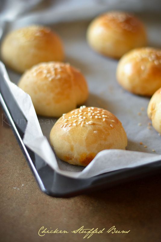 small rolls sitting on top of a baking sheet