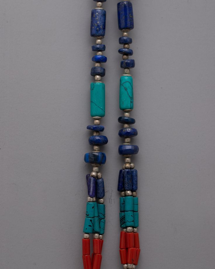 Nepal Tibetan Jewelry Necklace About Our Locket Introducing the exquisitely crafted Nepal Tibetan Jewelry Necklace, which blends traditional workmanship with vivid colors and materials. This gorgeous necklace is 28 cm long and weighs 0.056 kg. It is made of white metal and is embellished with artificial stones such as lapis lazuli, turquoise, and coral. The building pattern and stone choices pay homage to the rich artistic and cultural traditions of Tibetan and Nepalese jewelry. The Nepal Tibeta Traditional Gemstone Necklaces For Rituals, Artisan Jewelry With Natural Stones For Ceremonial Use, Traditional Gemstone Necklace For Rituals, Artisan Jewelry With Natural Stones For Ceremonial Occasions, Artisan Jewelry For Meditation And Festivals, Artisan Jewelry With Natural Stones For Ceremonies, Traditional Adjustable Turquoise Necklace, Traditional Jewelry With Round Natural Stone Beads, Traditional Jewelry With Round Natural Stones