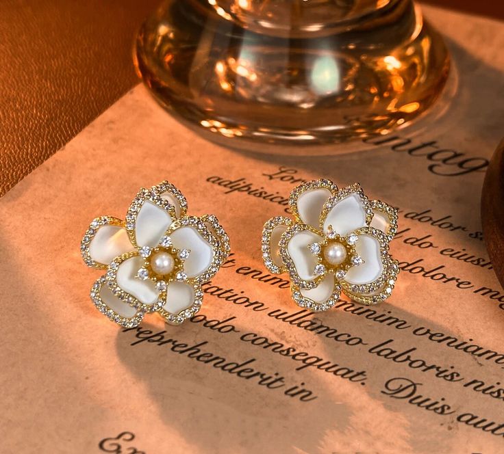 Featuring a high-end design and exquisite craftsmanship, this pair of earrings features zircon, artificial pearls, and silver earring pins. It is a high-quality and weighty pair of earrings White Camellia Flower, White Camellia, Earring Pins, Camellia Flower, Silver Earring, Flower Earrings, Jewelry Earrings Studs, Favorite Jewelry, Silver Earrings