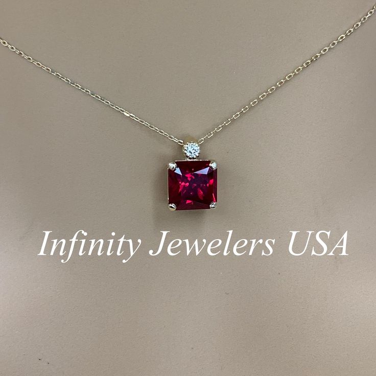 "The pendant pictured is lab created ruby #6337 -Approximate total carat weight: 3.13ctw diamond equivalent -Center Stone Size: approx. 3.10ct diamond equivalent -Center Stone Shape: radiant 8x8mm -Gem Type: lab created ruby -Stone Clarity: AAA -Stone Color: Red -Moh's Scale: 9 hardness -Accent Stones: 1 round -Accent Stones Size: approx. 0.03ct -Gem Type: natural diamond -Stone Clarity: SI1 -Stone Color: G -Moh's Scale: 10 hardness -Metal Type and Purity: 14k yellow gold -Setting: 4 prong baske Dazzling Lab-created Ruby Gemstone Jewelry, Fine Jewelry With Vvs Clarity Lab-created Ruby, Dazzling Lab-created Ruby Jewelry As Gift, Dazzling Lab-created Ruby Jewelry For Gift, Gift Necklace With Prong Setting And Lab-created Ruby, Yellow Gold Jewelry With Lab-created Ruby And Accent Stones, Elegant Necklace With Prong Setting And Lab-created Ruby, Elegant Necklace With Lab-created Ruby And Prong Setting, Fine Jewelry With Lab-created Ruby Gemstone