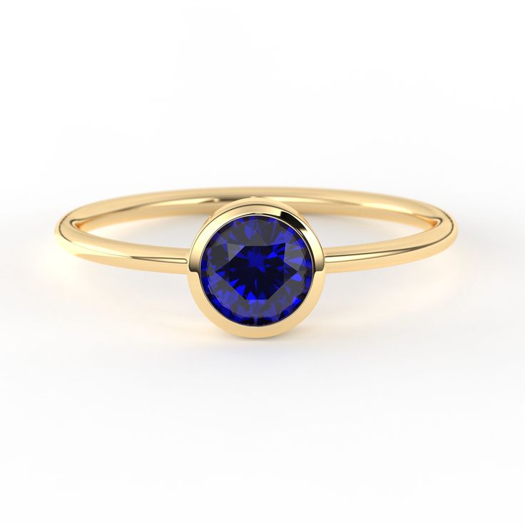 Our Sapphire Round Diamond Minimalist Solid Gold Stacking Ring is a delicate ring that can be customized as your choices. The bezel setting offers both protection for the stone and a stylish presentation. This type of setting is known for its clean and minimalist aesthetic, allowing the focus to be primarily on the beauty of the solitary gem. Its personalized birthstone make this sparkly ring a specail Birthday Gift or a Baby Shower Gift. Its blue sapphire bezel set gemstone can be customized as Minimalist Sapphire Ring With Bezel Setting For Everyday, Round Sapphire Ring With Smooth Bezel For Promise, Fine Jewelry Sapphire Ring With Smooth Bezel For Gift, Fine Jewelry Sapphire Ring With Smooth Bezel, Dainty Bezel Set Sapphire Anniversary Ring, Dainty Sapphire Ring With Bezel Setting For Anniversary, Minimalist Sapphire Ring With Bezel Setting As Gift, Adjustable Bezel Set Sapphire Ring Gift, Classic Sapphire Ring With Smooth Bezel As Gift