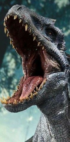 a close up of a toy dinosaur with its mouth open