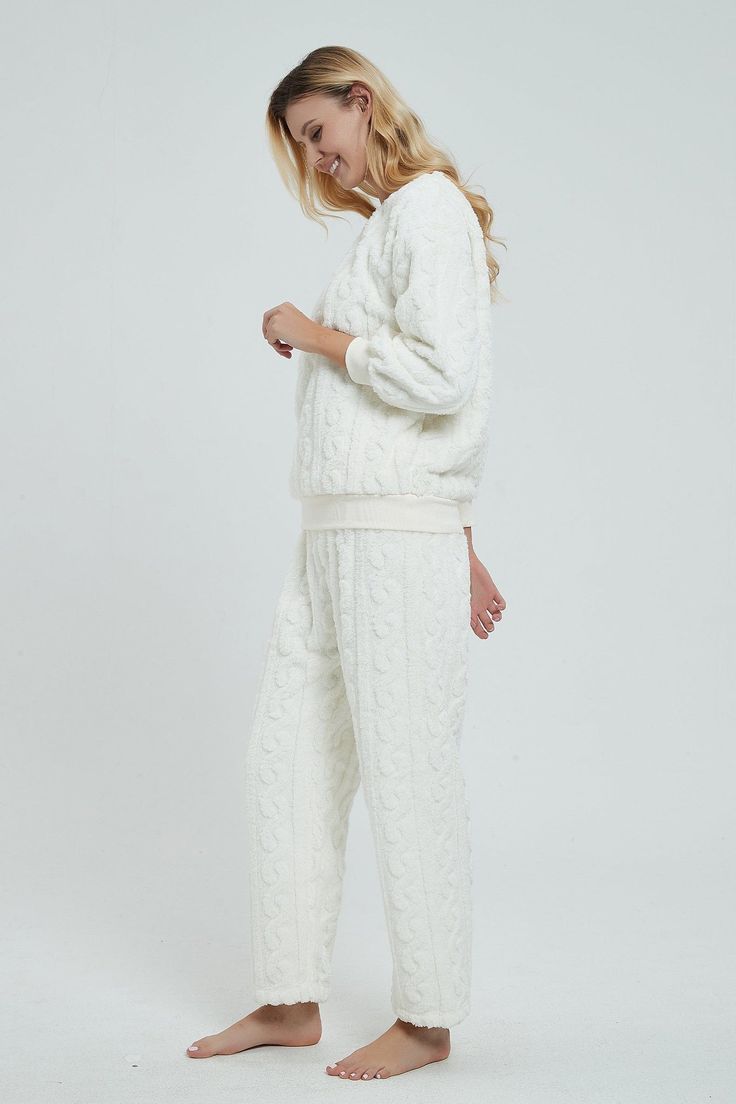 We can’t wait to cuddle up with a hot drink and that special someone in the Andromeda Cozy Fluffy Fleece Matching Pajamas Set! Made from the softest and warmest soft fleece fabric, this set offers a top featuring a crew neckline, long sleeves, and a relaxed bodice. Ribbed detailing accents the cuffs and hem. The matching pajamas have a slightly oversized fit with relaxed pant legs, ending in an ankle-length hem. 

Fluffy fleece fabric
Ribbed accents
Cozy, oversized fit
Soft and stretchy