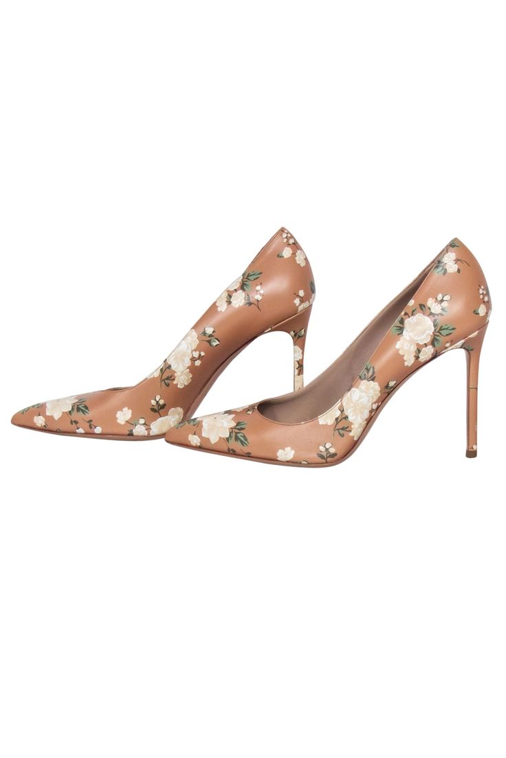 Let your style bloom at the office with a pair of classic Michael Kors pumps! This timeless workwear staple is brought to the next level with its gorgeous floral print and chic stiletto heel. These leather beauties pair perfectly with your favorite power suit or a green sheath dress for a polished look. Size 10 (MK 41) Leather Made in Italy Pointed-toe Stiletto heel Heel height 4.25" Michael Kors High Heels For Spring, Feminine Padded Heel Court Shoes For Spring, Feminine Spring Court Shoes With Padded Heel, Chic Formal Heels With Floral Print, Chic Floral Print Heels For Formal Occasions, Michael Kors Fitted Heels For Formal Occasions, Feminine Spring Court Shoes With Sculpted Heel, Feminine Court Shoes With Sculpted Heel For Spring, Chic Floral Print Heels For Spring