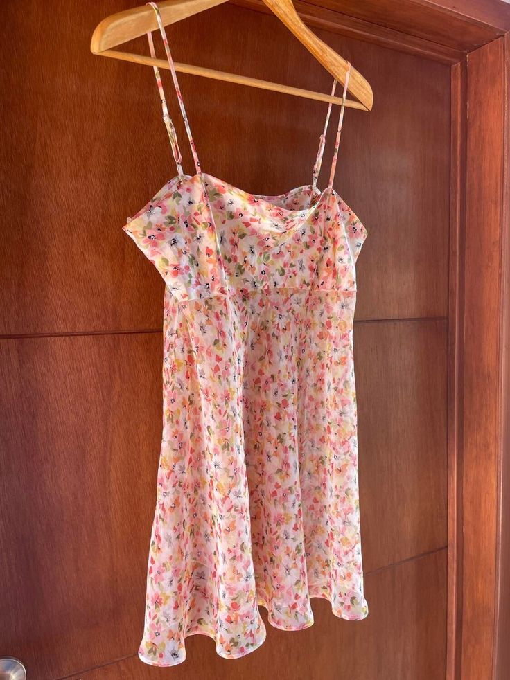 Beautiful vintage pink floral semi sheer dress with silky top, adjustable spaghetti straps and flowing short skirt! Perfect for lingerie or can be worn as a top paired with shorts! Excellent vintage condition  Fits best M/L  100% polyester  Measurements taken across: armpit to armpit: 19" waist: 25" length: 20" Summer Sheer Slip Dress With Spaghetti Straps, Sheer Slip Dress With Spaghetti Straps For Summer, Pink Camisole Mini Dress For Spring, Pink Camisole Mini Dress For Summer, Sheer Cami Slip Dress For Summer, Sheer Spaghetti Strap Slip Dress For Spring, Spring Pink Cami Mini Dress, Spring Slip Sundress With Built-in Bra, Pink Camisole Dress With Adjustable Straps