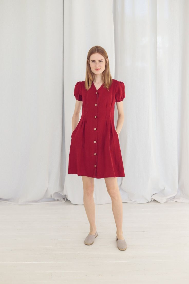 "DETAILS * Dress will make you more charming and elegant wherever you wear it! * Functional buttons down * With two side pockets * Slim fit summer dress * Made from soft wash medium weight (185 g) 100 % European linen fabric * Height of the model is 177 cm (5' 8\") and she is wearing size XS dress in ruby red color * The full length of linen dress is +/-95 cm/ 37.4\" * Available in 20 colors. Please choose another color and size on the right * Product number: D28. CARE LABEL * machine wash gentl Summer Mid-length Dress With Button Closure, Summer Button-up Shirt Dress With Pockets, Solid Color Knee-length Mini Dress With Pockets, A-line Dress With Pockets For Daywear, Solid Knee-length Mini Dress With Pockets, Mini Dress With Pockets For Day Out, Chic Solid Dresses With Pockets, Casual Midi Length Puff Sleeve Dress For Work, Red Dress With Pockets For Day Out