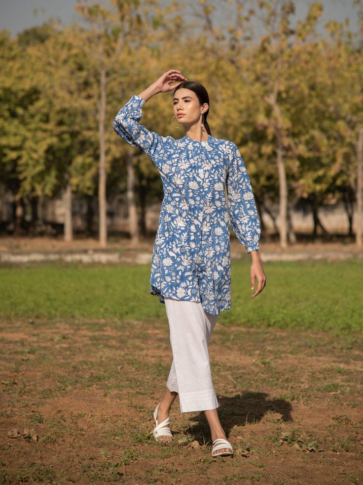 No more blues tunic white kurti cotton printed by Marche now availablea at Trendroots Curved Hem Tops For Daywear In Spring, Summer Casual Straight Kurta Blouse, Casual Asymmetrical Hem Tops For Daywear, Relaxed Fit Cotton Tunic For Daywear, Casual Tops With Curved Hem For Daywear, Cotton Tunic With Relaxed Fit For Daywear, Blue Asymmetrical Hem Blouse For Fall, Blue Blouse With Shirttail Hem, Summer Daywear Tops With Curved Hem