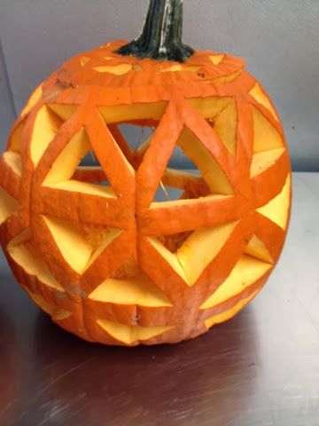 a carved pumpkin sitting on top of a table